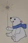 Mobile Preview: Stickdatei Set Eisbären Applikationen, Foto mit bestickter Applikationen auf hellem Stoffuntergrund. Weißer Eisbär trägt blauen Schal. In der Hand Schneeflocke.