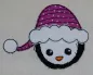 Preview: Stickdatei Set Christmas Faces Doodle-Applikationen, Foto von Applikation Schneemannkopf mit Mütze, aufgebracht auf hellen Stoff.