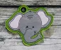 Preview: Stickdatei Elefant Applikation in 5 Größen + ITH Anhänger, Foto zeigt Anhänger Elefantenkopf, oben garngeöst. Auf grünem Untergrund grauer Kopf mit rosa Innenohren.