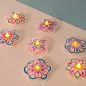 Preview: LED Cover Stickdatei als Blume. Das LED Licht schaut aus dem Blütenstempel heraus.