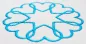 Preview: Stickdatei Set Herz Ornamente 8 x 8 / 7,6 x 7,5 / 7 x 7 / 7,2 x 7,2 cm, Foto einer türkisblauen Bestickung eines hellen Stoffs. Ornament besteht aus 8 im Kreis angeordneten Herzen, die sich leicht überschneiden, so dass im Zentrum der Eindruck eines Stern