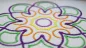 Preview: Stickdatei-Set Ornamente Dream 10 x 10 cm. Foto zeigt liegende Ansicht mit bogenartigem Blütenornament in eher grober Ausfertigung auf hellem Stoff. 5-farbig.