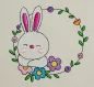 Preview: Osterhase mit floralem Kranz ausgestickt auf Baumwolle.