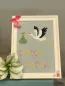 Preview: Stickdatei Set Hello Baby (div. Größen), Foto zeigt Bilderrahmen mit eingespanntem gräulichem Stoff. Dieser ist bestickt mit einem Klapperstorch mit Stoffbeutel im Schnabel. Darunter Schriftzug "Emma Lotta".