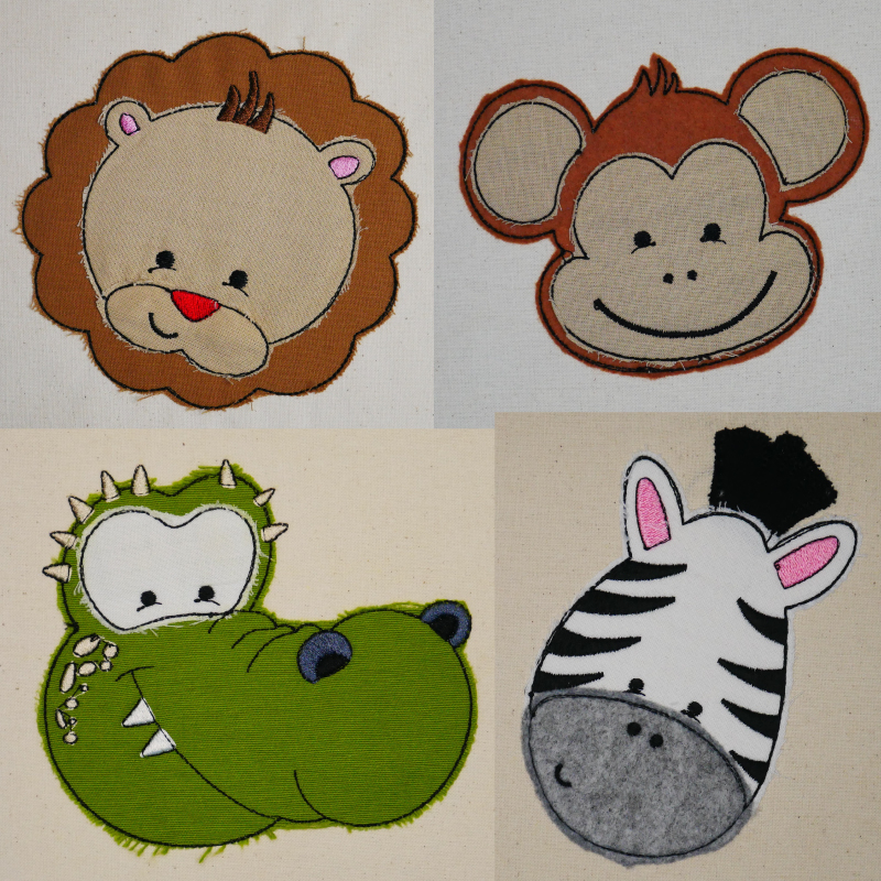 Stickdatei Set Animal Faces Applikationen 8 Motive in je 5 Größen + ITH Anhänger, Ansicht zeigt 4 Applikationen auf Stoff. Löwenkopf in mittelbraun-beige; Affenkopf in mittelbraun-beige; Krokodil in moosgrün mit weiß-schwarzen Augen; Zebrakopf schwarz-wei