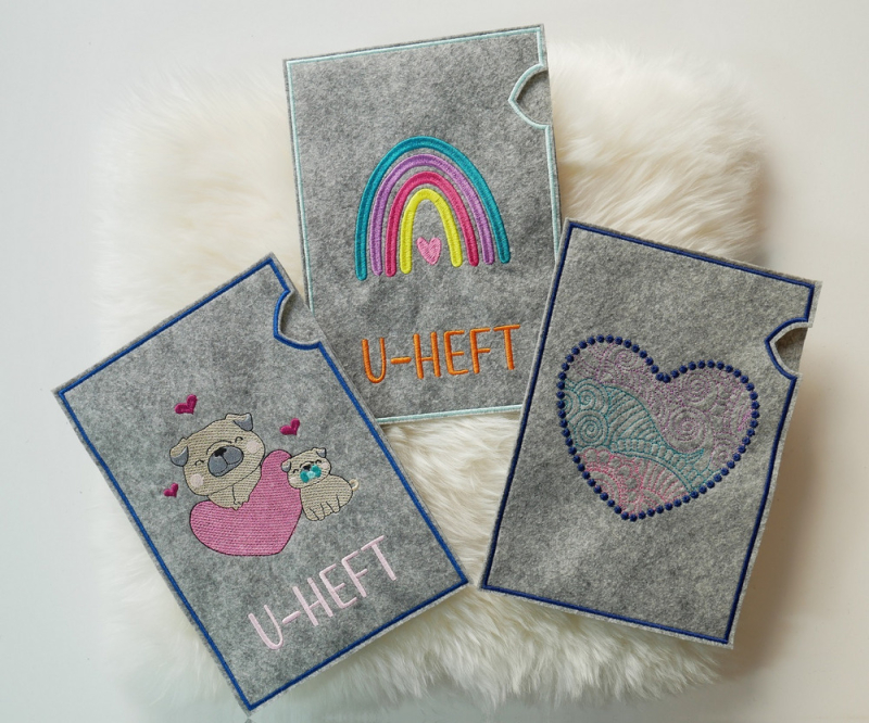 Preview: ITH U-Heft-Hüllen mit Regenbogen, Mops und Herz.