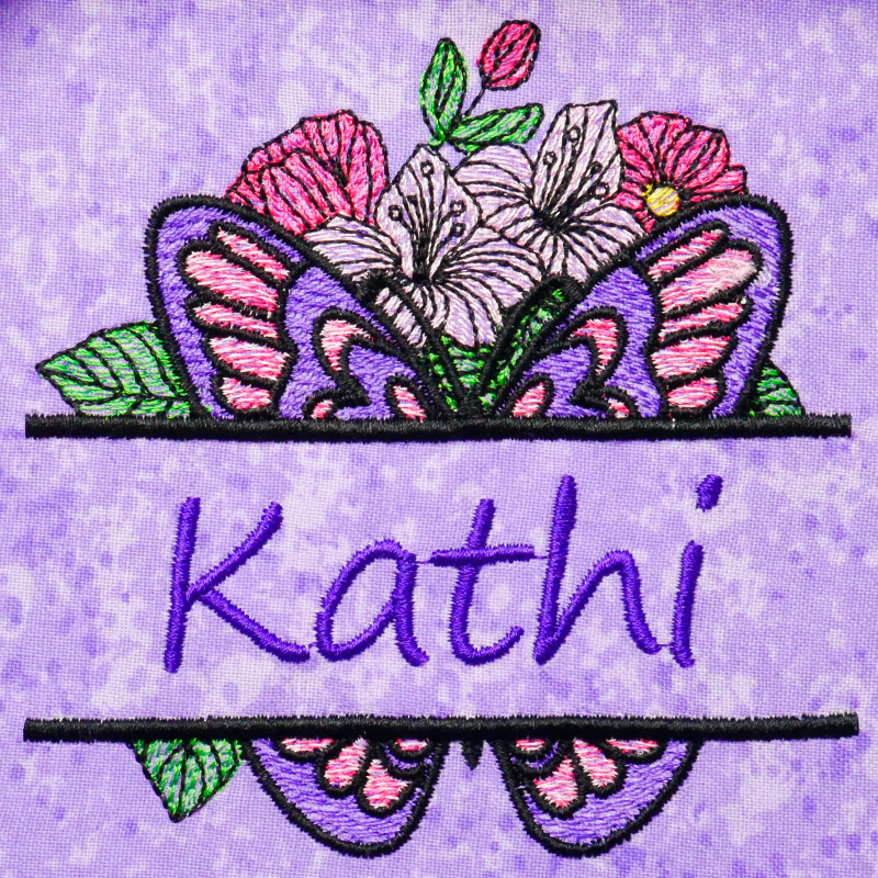 Preview: Splitted Butterfly auf lila Stoff aufgestickt