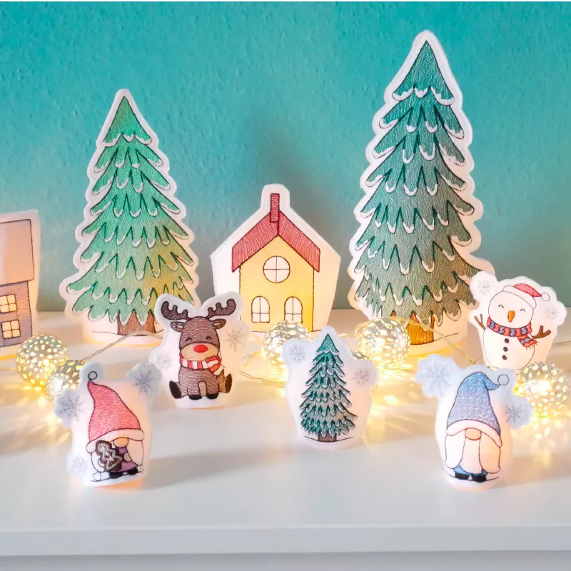 Stickdatei Set ITH LED Cover Winterdorf mit Gnomen, Schneemann und Rentier.