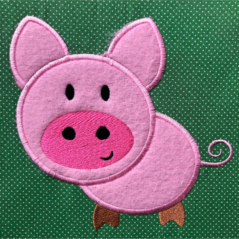 Applikation Schwein rosa auf grün gepunktetem Stoff